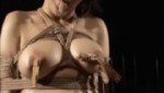 三角木馬に座らせた緊縛M奴隷の巨乳をクリップ責め